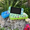 image:imageSonix x Monchhichi Carrying Case for Nintendo Switch 2 Switch 1 Lite OLED Protective Travel Case with Game Cartridge Storage  Monchhichi Red DotHello Kitty Island Adventure AOP