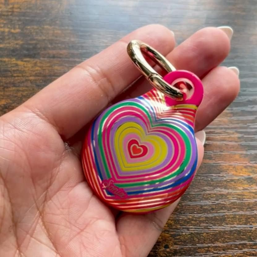 image:imageSonix Cases for Apple AirTags with Gold Carabiner  AirTag Hard Cover Protective Case  AirTag Holder Keychain  Jelly ApricotRainbow Heart
